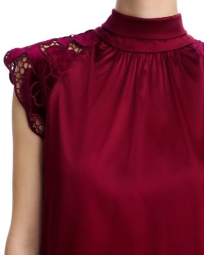 A burgundy blouse with lace sleeves demonstrating Elements Of Image's Academy Awards Styling Method